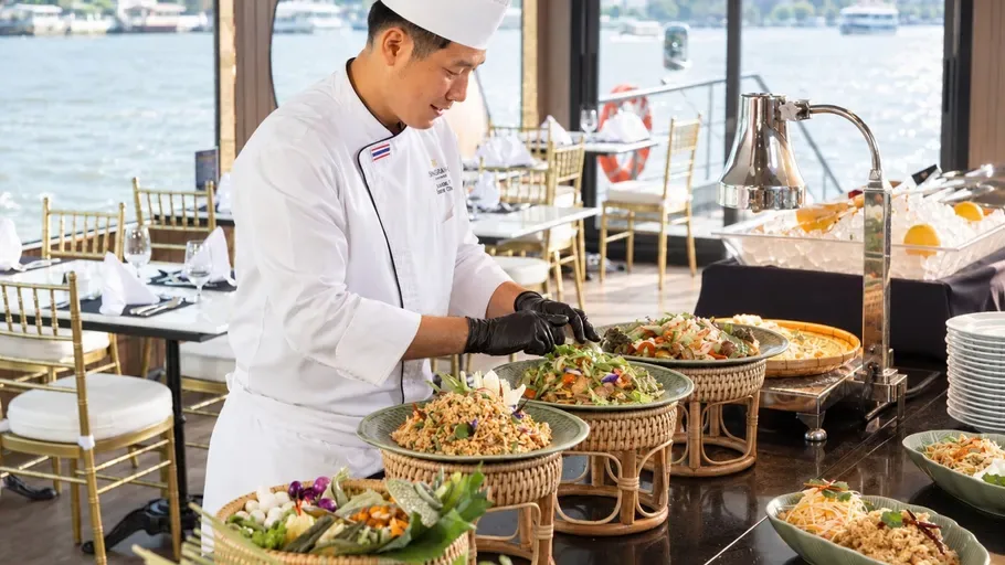 Chef preparing the buffet aboard the Shangri-La Horizon dinner cruise on the Chao Phraya River